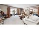 Spacious living room featuring bay windows and a neutral color scheme at 7425 Cherryhill Dr, Indianapolis, IN 46254