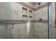Large walk-in shower with tile surround and built-in shelves at 7425 Cherryhill Dr, Indianapolis, IN 46254