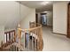 View of an upstairs hallway with a curved staircase at 7425 Cherryhill Dr, Indianapolis, IN 46254