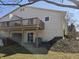 Backyard view featuring a spacious deck and sliding glass door access at 7629 Farm View W Cir, Indianapolis, IN 46256