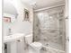 Modern bathroom featuring a glass enclosed shower with marble-patterned tile at 7629 Farm View W Cir, Indianapolis, IN 46256