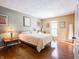 Bedroom with hardwood floors, natural light, and neutral color palette at 7629 Farm View W Cir, Indianapolis, IN 46256