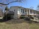 Exterior view of the home highlighting the deck and landscaped yard at 7629 Farm View W Cir, Indianapolis, IN 46256