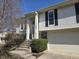 Inviting front entrance with white columns, leading to the front door at 7629 Farm View W Cir, Indianapolis, IN 46256