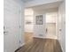 Hallway leading to the laundry room with washer and dryer at 7629 Farm View W Cir, Indianapolis, IN 46256