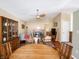 Inviting living room featuring a fireplace, ceiling fan, and hardwood floors at 7629 Farm View W Cir, Indianapolis, IN 46256