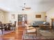 Inviting living room with hardwood floors, ceiling fan, and cozy furnishings at 7629 Farm View W Cir, Indianapolis, IN 46256