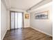 Spacious living room featuring wood-look flooring and natural light at 7629 Farm View W Cir, Indianapolis, IN 46256