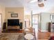 Living room with hardwood floors, modern furniture, and an open layout at 7629 Farm View W Cir, Indianapolis, IN 46256