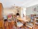 Open-concept living space with dining area, hardwood floors, and modern decor at 7629 Farm View W Cir, Indianapolis, IN 46256