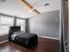 Small bedroom with dark gray walls and wood floors at 8231 Spring Valley Dr, Plainfield, IN 46168