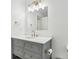Bathroom with gray vanity, white quartz countertop, and gold fixtures at 901 N 700 W, Greenfield, IN 46140