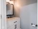 Modern bathroom with a sleek white vanity, marble countertop, and matte black fixtures at 901 N 700 W, Greenfield, IN 46140