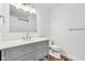 Modern bathroom with gray vanity, white quartz countertop, and gold fixtures at 901 N 700 W, Greenfield, IN 46140