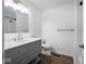 Bright bathroom with a gray vanity, white countertop, and a shower with white tiled walls at 901 N 700 W, Greenfield, IN 46140