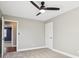 Spacious bedroom with ceiling fan and access to hallway at 901 N 700 W, Greenfield, IN 46140