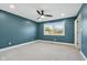 Spacious bedroom with new carpet, ceiling fan, and fresh paint at 901 N 700 W, Greenfield, IN 46140