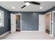 Bedroom with plush carpet, a ceiling fan, and doorways to additional rooms at 901 N 700 W, Greenfield, IN 46140