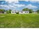 Charming single-story home with a well-manicured lawn, black shutters, and white siding at 901 N 700 W, Greenfield, IN 46140