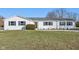 White ranch house with green shutters, landscaping, and a spacious lawn at 901 N 700 W, Greenfield, IN 46140