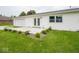 Desirable home exterior with an attached garage, patio, and manicured landscaping at 901 N 700 W, Greenfield, IN 46140