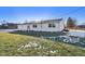 View of the back of the house showcasing the garage and patio at 901 N 700 W, Greenfield, IN 46140