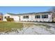 White ranch house with green shutters and landscaping at 901 N 700 W, Greenfield, IN 46140