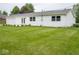 Charming home exterior features a well-manicured lawn, attached garage and freshly painted siding at 901 N 700 W, Greenfield, IN 46140