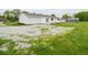 Well-maintained home with a spacious driveway and landscaped front yard, with green grass at 901 N 700 W, Greenfield, IN 46140