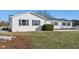 White siding house with green shutters and partial snow coverage at 901 N 700 W, Greenfield, IN 46140