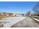 White ranch house with gravel driveway and partial snow coverage at 901 N 700 W, Greenfield, IN 46140