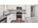 Updated kitchen with stainless steel appliances and granite countertops at 901 N 700 W, Greenfield, IN 46140