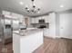 Modern kitchen featuring white cabinets, stainless steel appliances, and a granite countertop island at 901 N 700 W, Greenfield, IN 46140
