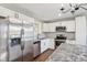 Modern kitchen with stainless steel appliances and granite countertops at 901 N 700 W, Greenfield, IN 46140