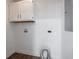 Laundry room features white walls and wood floors at 901 N 700 W, Greenfield, IN 46140