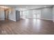 Open-concept space with wood floors connecting the living, dining, and kitchen areas at 901 N 700 W, Greenfield, IN 46140
