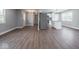 Spacious open-concept layout connecting the living room, hallway, and kitchen with modern flooring at 901 N 700 W, Greenfield, IN 46140