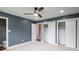 Spacious bedroom with a ceiling fan, large closets, plush carpet, and an ensuite bathroom at 901 N 700 W, Greenfield, IN 46140