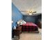 Main bedroom with king bed, nightstand, and ceiling fan at 975 Stonegate Rd, Greenwood, IN 46142