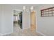 Dining room with tile floor, chandelier, and access to kitchen and hallway at 1017 Village Cir, Greenwood, IN 46143