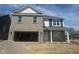 New two-story home with brick and siding, attached garage, and covered porch at 1350 Foxtail Ln, Greenwood, IN 46143