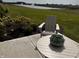 Patio furniture set with a small table and chair overlooking a pond at 1350 Foxtail Ln, Greenwood, IN 46143