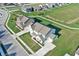 Aerial view of two homes, showcasing neighborhood layout and landscaping at 14115 Larson Dr, Carmel, IN 46033