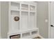 White built-in bench with cubbies, hooks, and storage at 14115 Larson Dr, Carmel, IN 46033