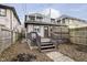 View of backyard with deck and steps leading to house at 1421 E New York St, Indianapolis, IN 46201
