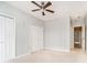 Well-lit bedroom with neutral walls and double closets at 1421 E New York St, Indianapolis, IN 46201