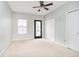 Spacious bedroom with neutral walls, ceiling fan, and ample closet space at 1421 E New York St, Indianapolis, IN 46201