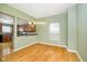 Bright dining room features hardwood floors and an open view to the kitchen at 1421 E New York St, Indianapolis, IN 46201