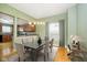 Dining room with hardwood floors and open kitchen view at 1421 E New York St, Indianapolis, IN 46201