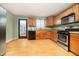 Kitchen with stainless steel appliances and wood cabinets at 1421 E New York St, Indianapolis, IN 46201